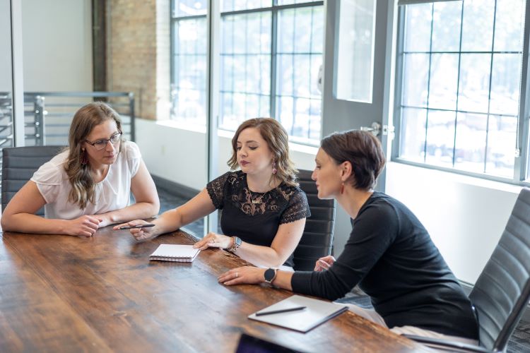 5 Considerations when Creating and Updating Your Employee Handbook example of employees writing